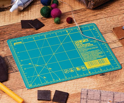 OLFA 6" x 8" Self Healing Rotary Cutting Mat (RM-6x8) - Double Sided 6x8 Inch Cutting Mat with Grid for Quilting, Sewing, Fabric, & Crafts, Designed for Use with Rotary Cutters (Green)